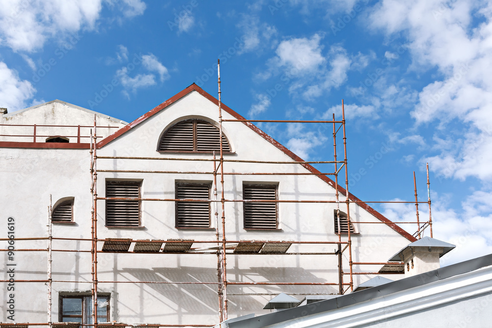 urban house restoration with scaffolding urban house restoration with scaffolding