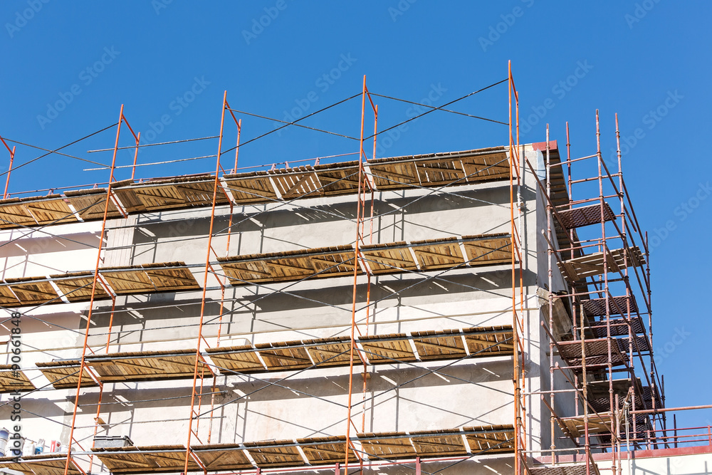 building under renovation with scaffolding