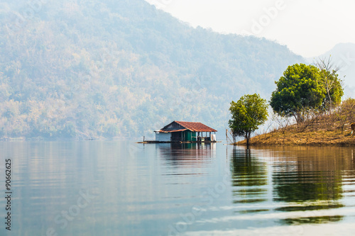 Floating house on river.