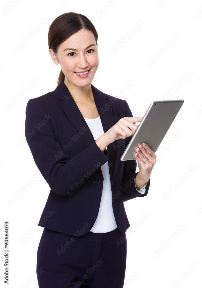 Asian businesswoman use of the tablet pc Asian businesswoman use of the tablet pc