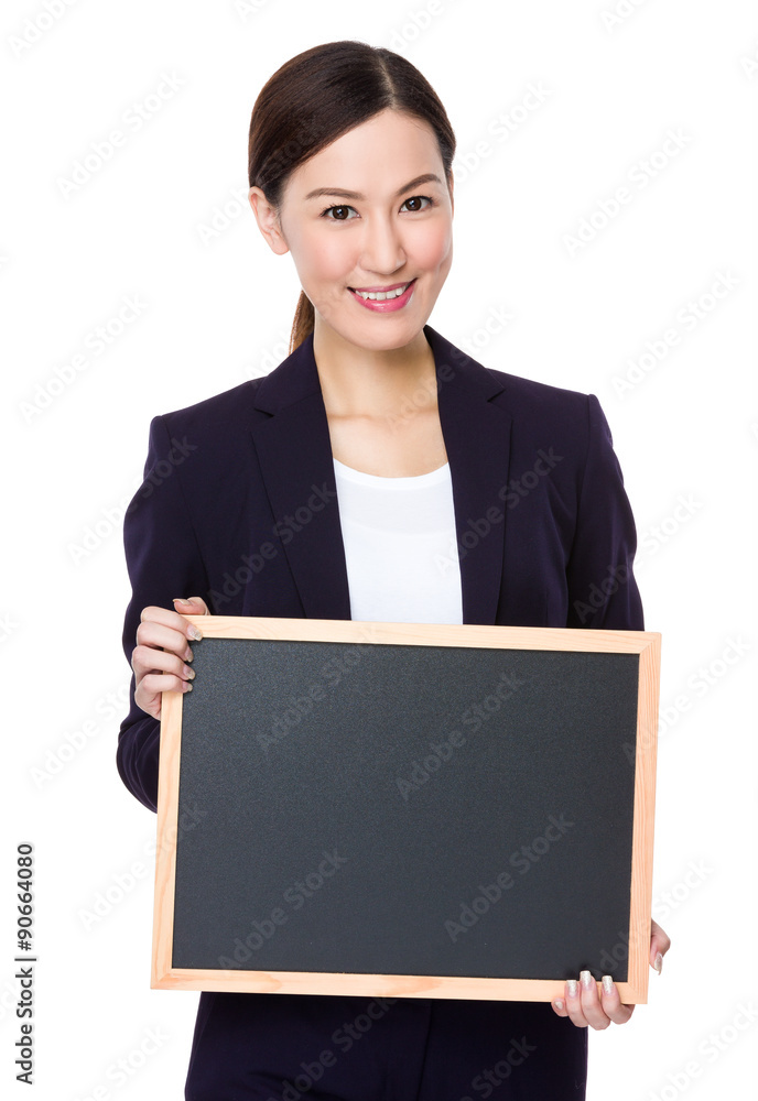 Young businesswoman show with the empty chalkboard Young businesswoman show with the empty chalkboard