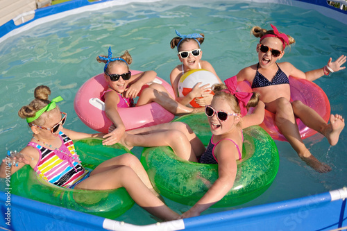 Portrait of children on the pool in summer