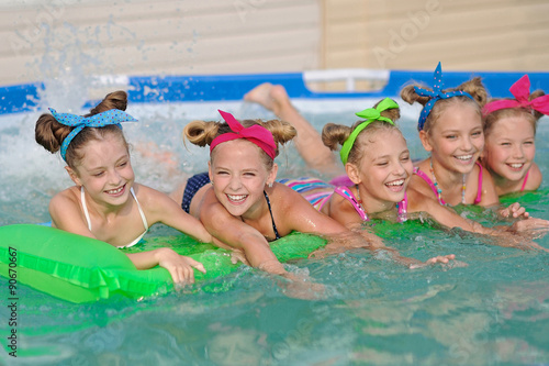 Portrait of children on the pool in summer