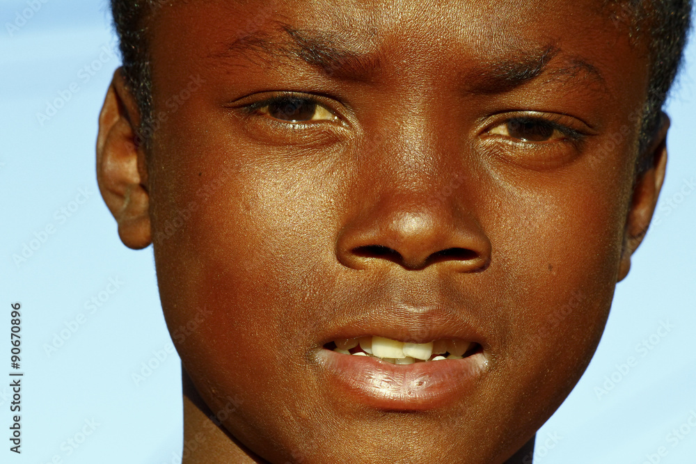 Fototapeta premium African boy - Confidence that can only grow out of a strong hear