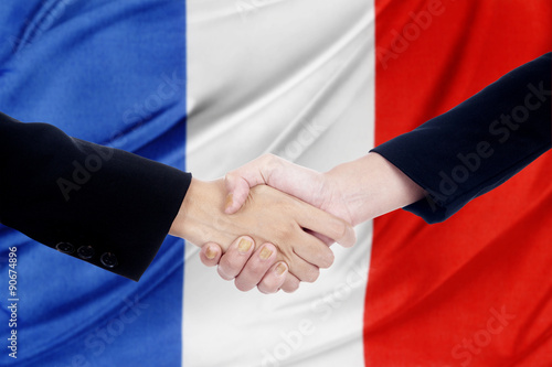 Handshake with a france flag background