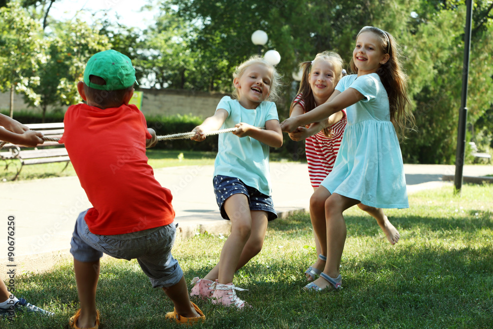 Fototapeta premium Happy active children playing in park