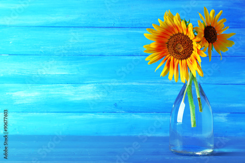 Fototapeta Naklejka Na Ścianę i Meble -  Beautiful sunflowers in vase on wooden background