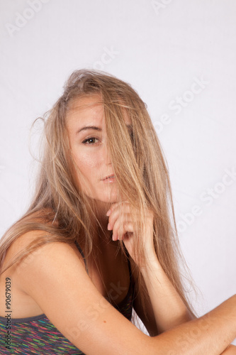 Pretty long haired woman looking thoughtful