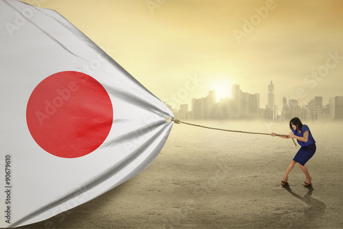 Young woman with a japan flag