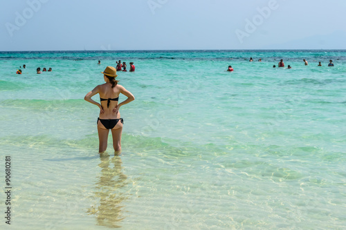 Travel woman with hat looking out of sea, at bamboo island ,Krabi in Thailand © aon_skynotlimit