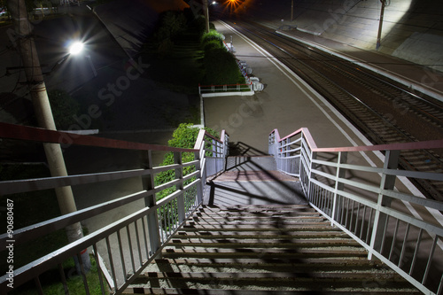 Fototapeta Naklejka Na Ścianę i Meble -  Railway station at night. Footbridge