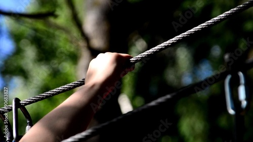 Dolly shot of Safety equipment for mountain climbing. Mountaineer woman clings to tether. action camera photo