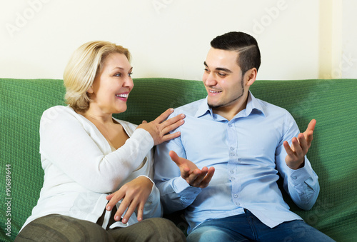 Son talking with senior mother photo