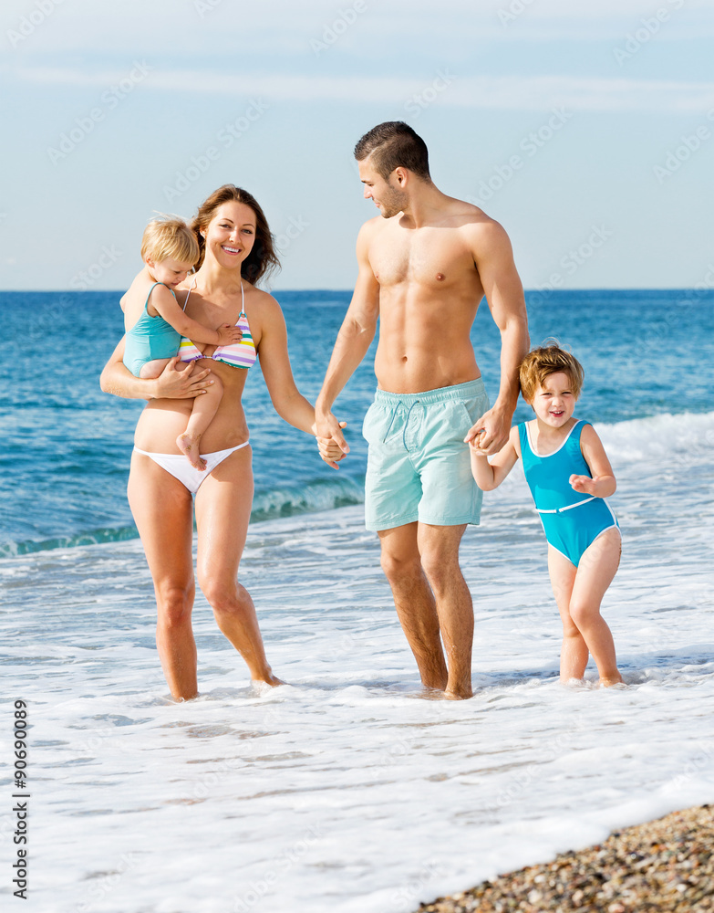 Family with two kids on beach