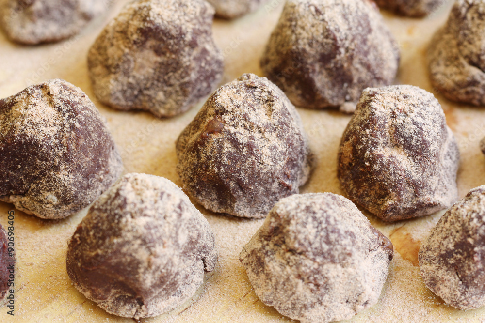 row of delicious confectionery - chocolate truffle with copy space
row of delicious confectionery - chocolate truffle with copy space