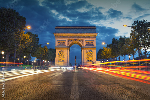 Arc de Triomphe. Image of the iconic Arc de Triomphe in Paris city during twilight blue hour. © rudi1976