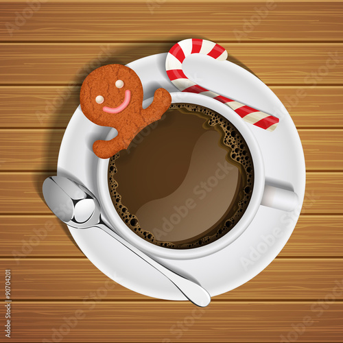 gingerbread in cup of hot chocolate with sugar cane