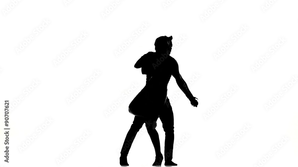 Two latino dancers in action, silhouette, on white Two latino dancers in action, silhouette, on white