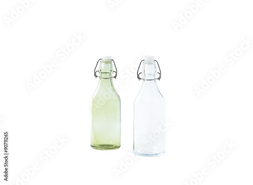 two empty colored white and green glass bottles, isolated on white background
