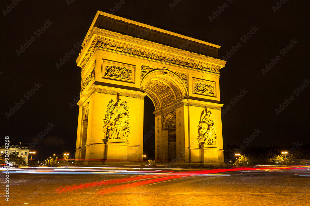 The Triumphal Arch at night.