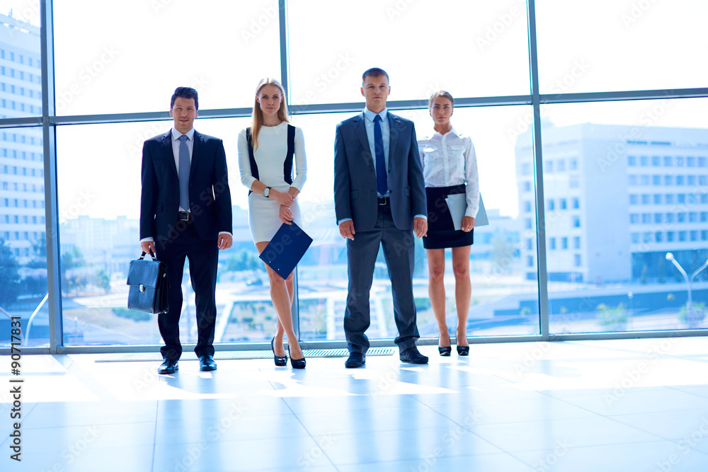 Young business people go down of modern office Young business people go down of modern office
