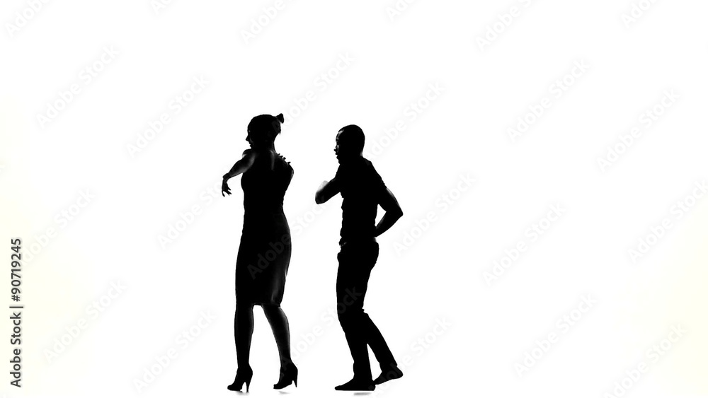 Latino dancers in action on white, silhouette, slow motion Latino dancers in action on white, silhouette, slow motion