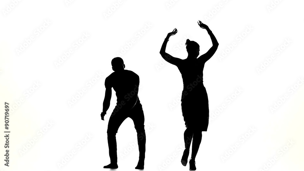 Couple of latino dancers in action on white, slow motion Couple of latino dancers in action on white, slow motion