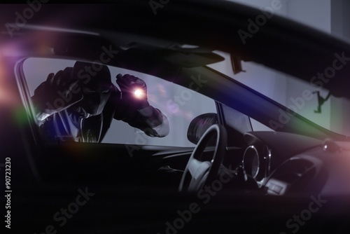 Car Robber with Flashlight Fototapet
