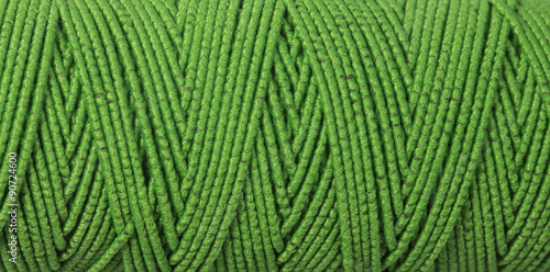 green thread, textured background