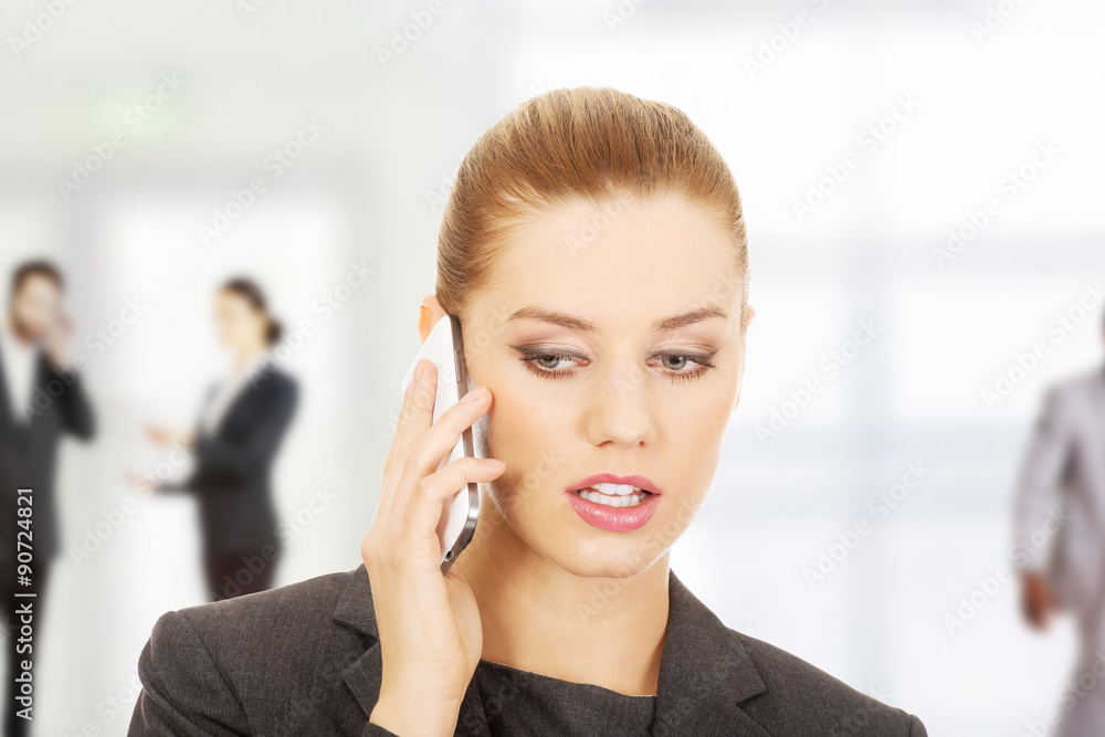 Businesswoman talking on mobile phone. Businesswoman talking on mobile phone.