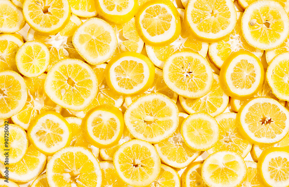 Full frame of bright yellow lemon slices shot from above Full frame of bright yellow lemon slices shot from above