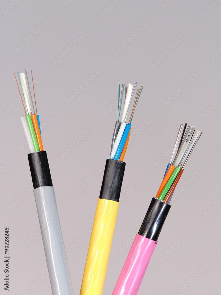 Different colored fiber optic cable ends with stripped jacket layers and exposed colored fibers left to right, Melbourne 2015 Different colored fiber optic cable ends with stripped jacket layers and exposed colored fibers left to right, Melbourne 2015