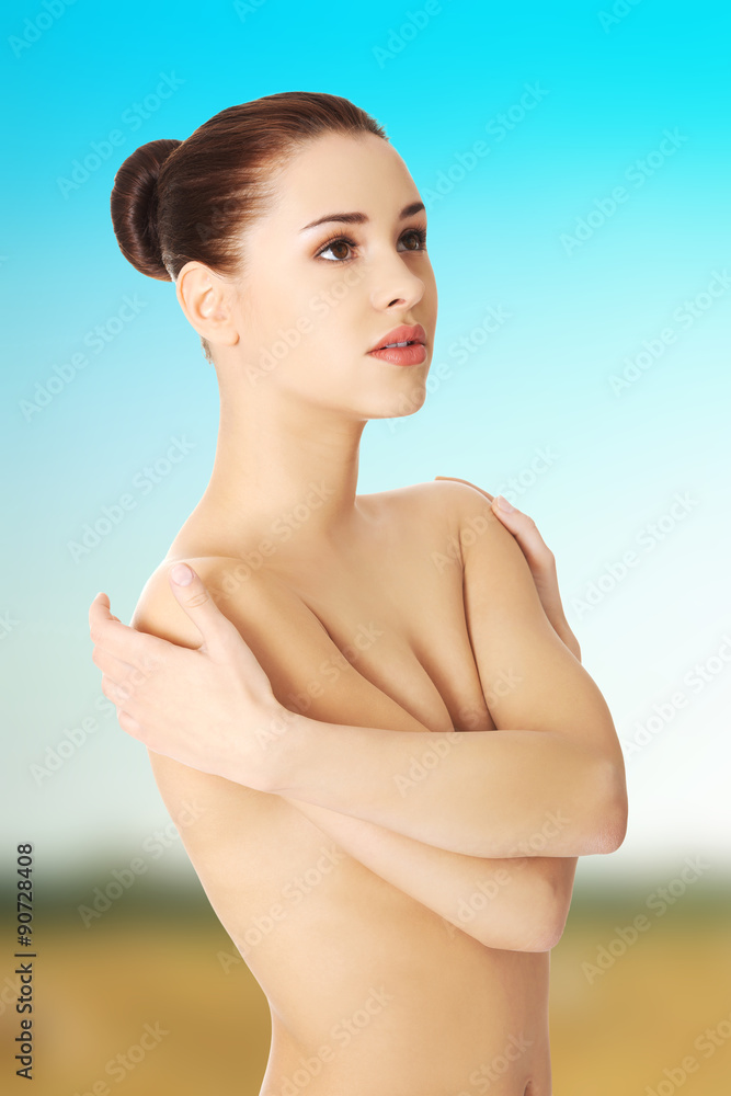 Woman covering breast Woman covering breast