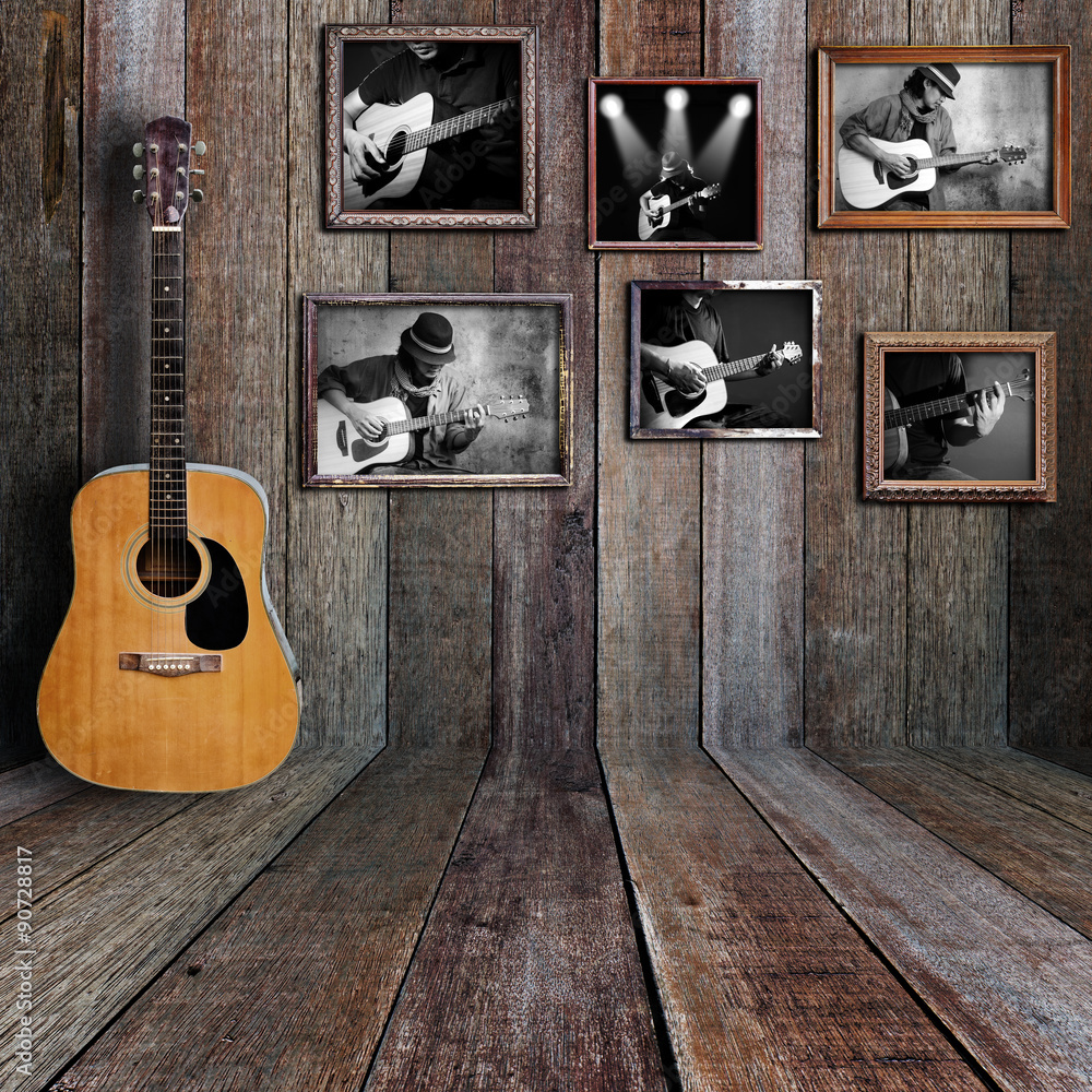 Fototapeta premium Guitar player photo in vintage wood room.