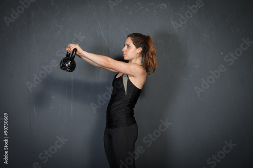 Woman doing kettlebell exercise