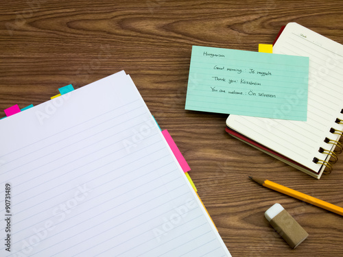 Hungarian  Learning New Language Writing Words on the Notebook © eikotsuttiy