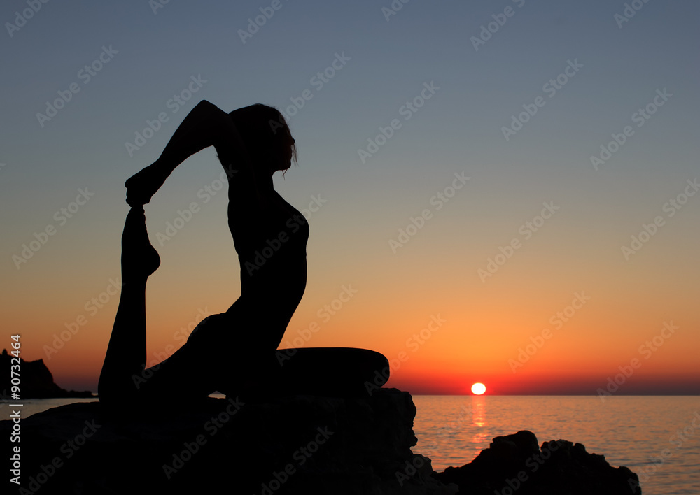 serenity and yoga practicing at sunset, meditation.Twilight in Goa state,India