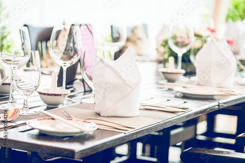 Table dining set in the hotel restaurant - light vintage filter