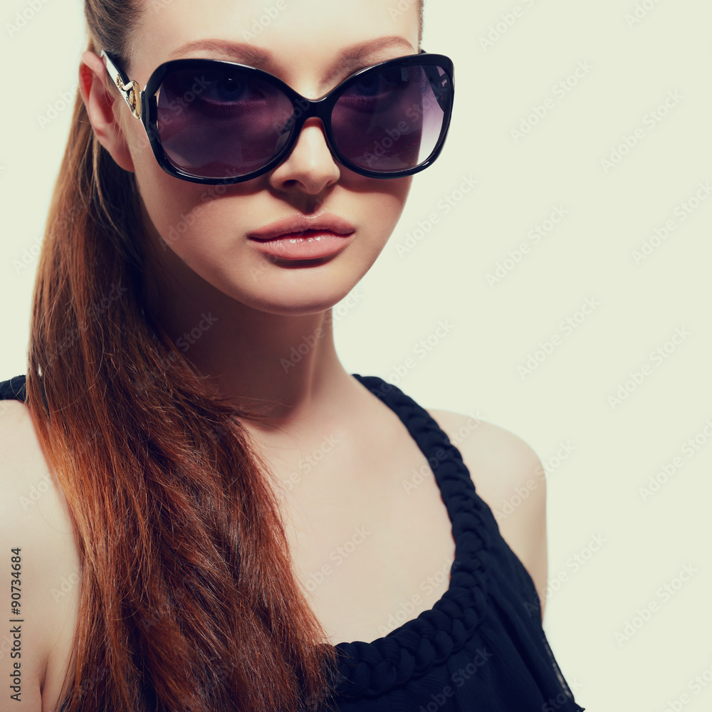 Beautiful young model with big sunglasses, close up, image toned Beautiful young model with big sunglasses, close up, image toned