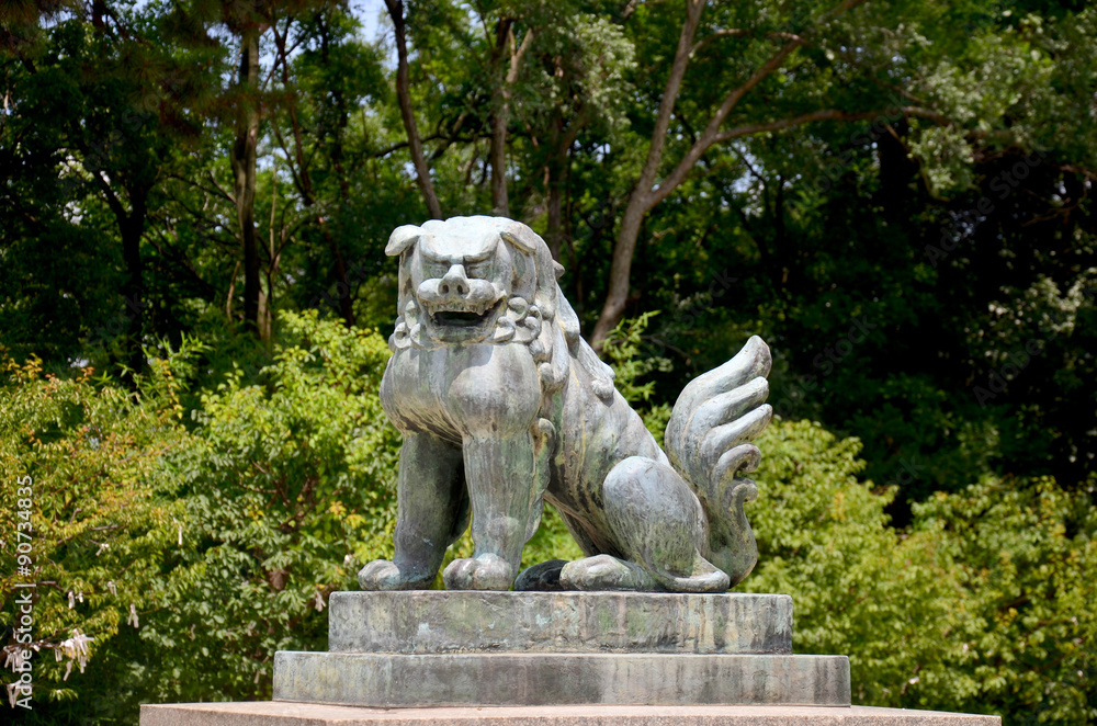 Lion guardian statue at Hokoku Shrine in Osaka Castle Park