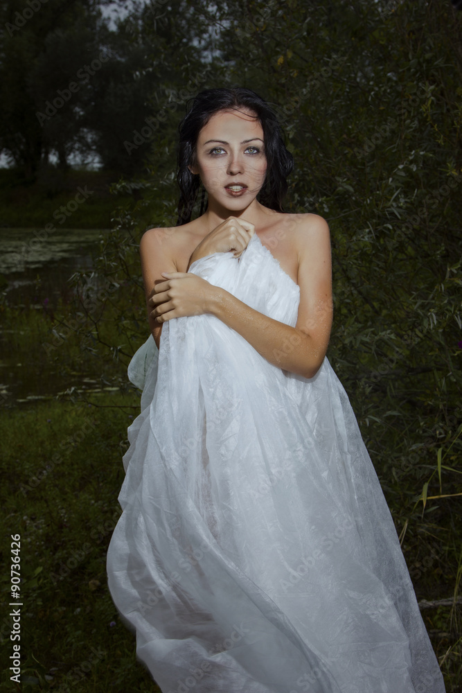Woman in white dress in the woods, on the lake, scared, fairytale scene