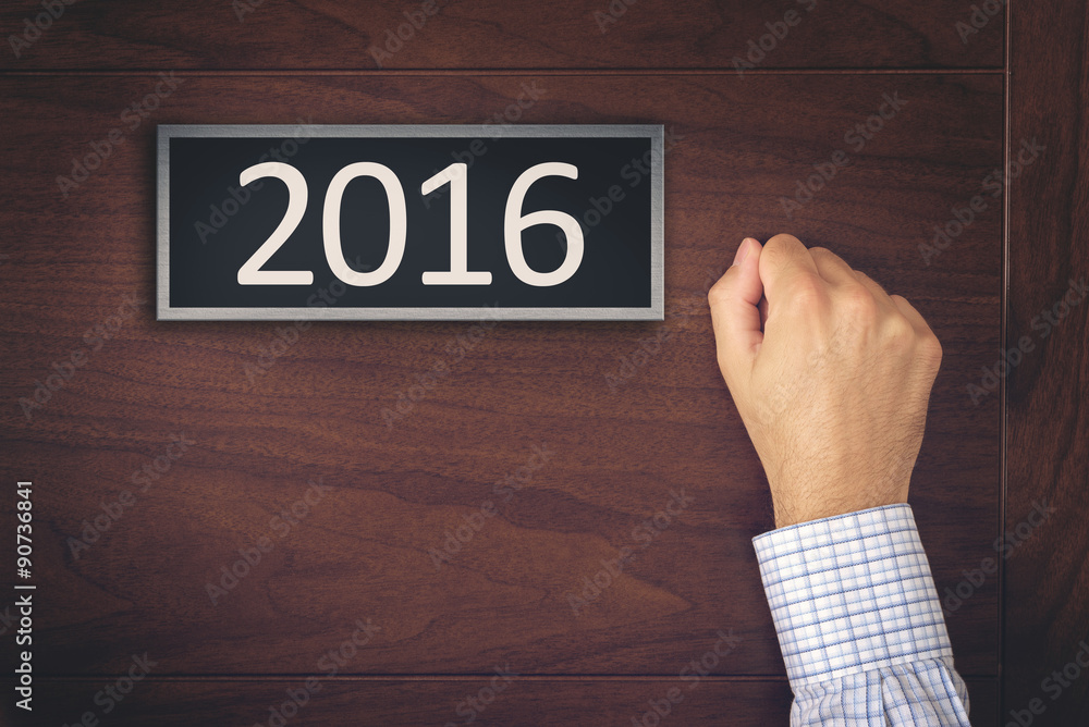 Businessman Knocking on New Year 2016 Door Businessman Knocking on New Year 2016 Door