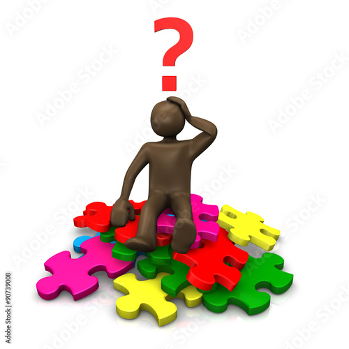Braunes Männchen sitzt auf einem Haufen Puzzlestücken unter ei