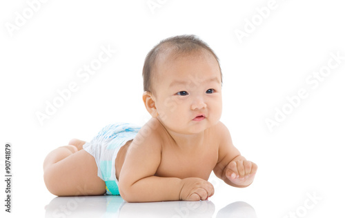 cute asian baby sitting on the floor isolated on white background
