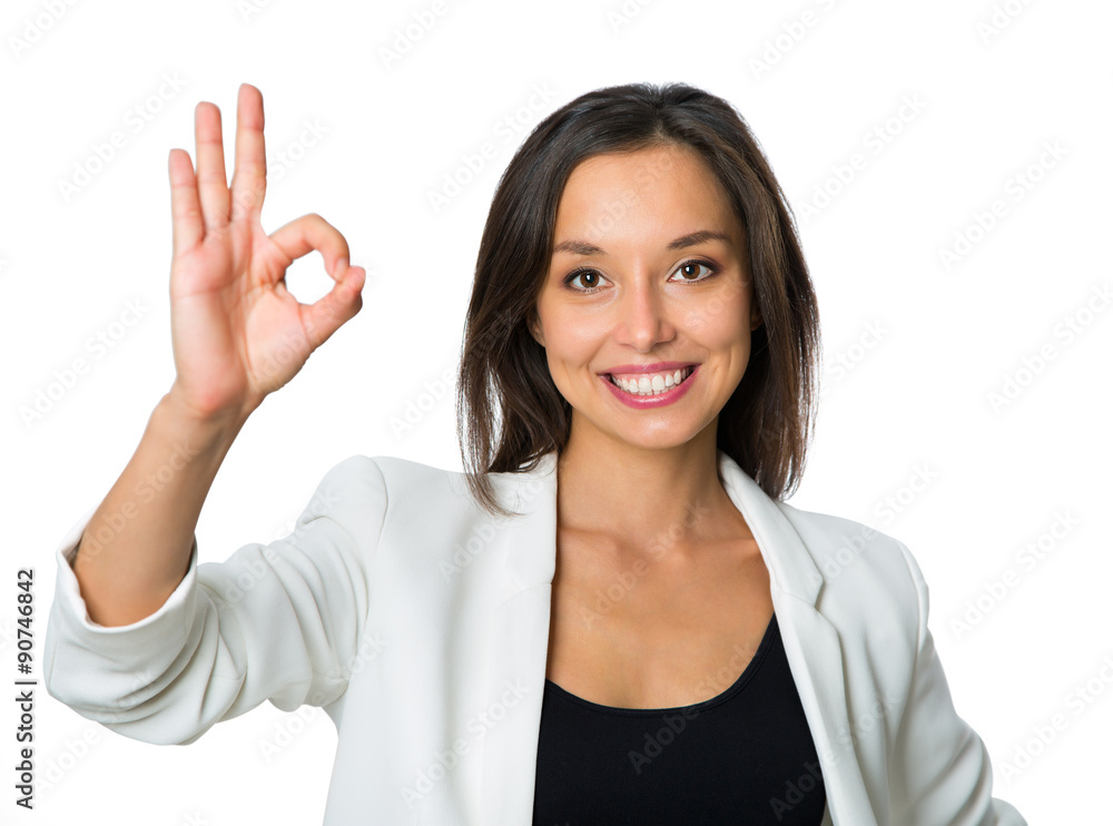 Business woman with an ok sign - isolated over a white backgroun Business woman with an ok sign - isolated over a white backgroun