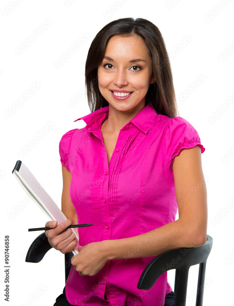 Young business woman sitting on a chair and looks into the camer Young business woman sitting on a chair and looks into the camer