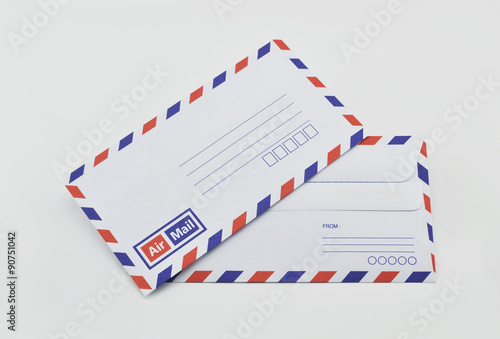 Stack of air mail envelopes on white background