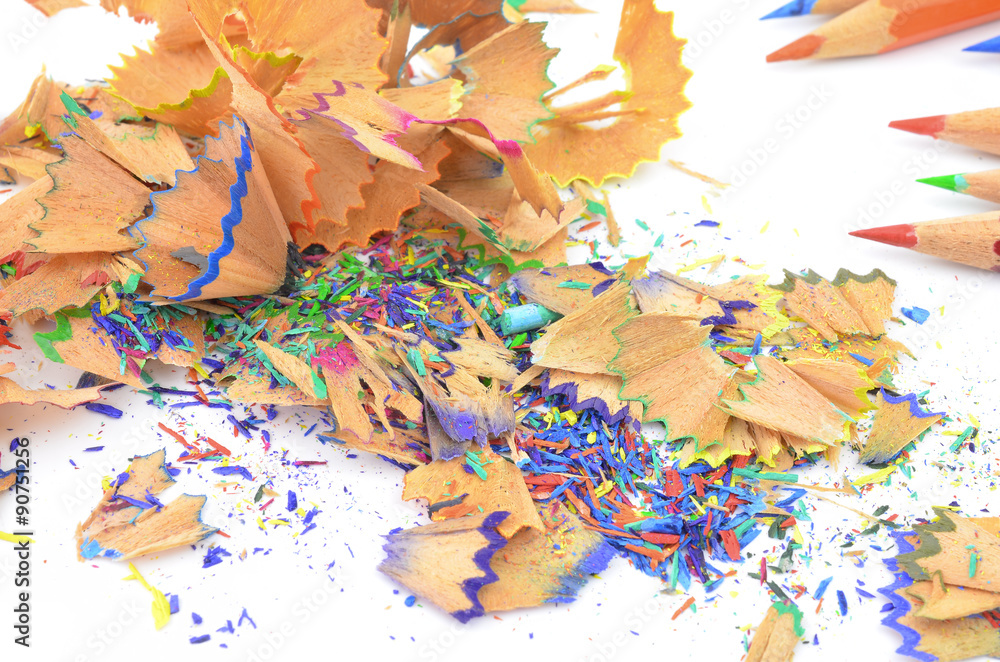 Shavings from multicolored pencils on white background Shavings from multicolored pencils on white background
