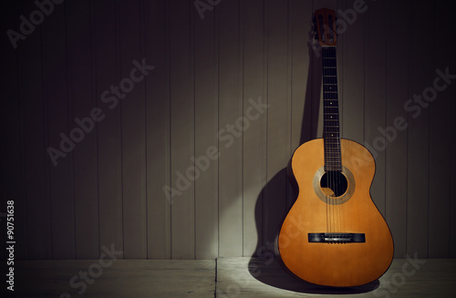Foto Classical guitar on wooden background
