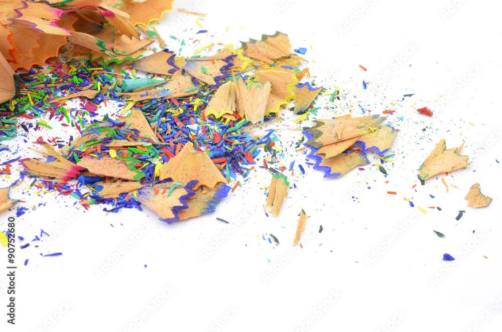 Shavings from multicolored pencils on white background Shavings from multicolored pencils on white background